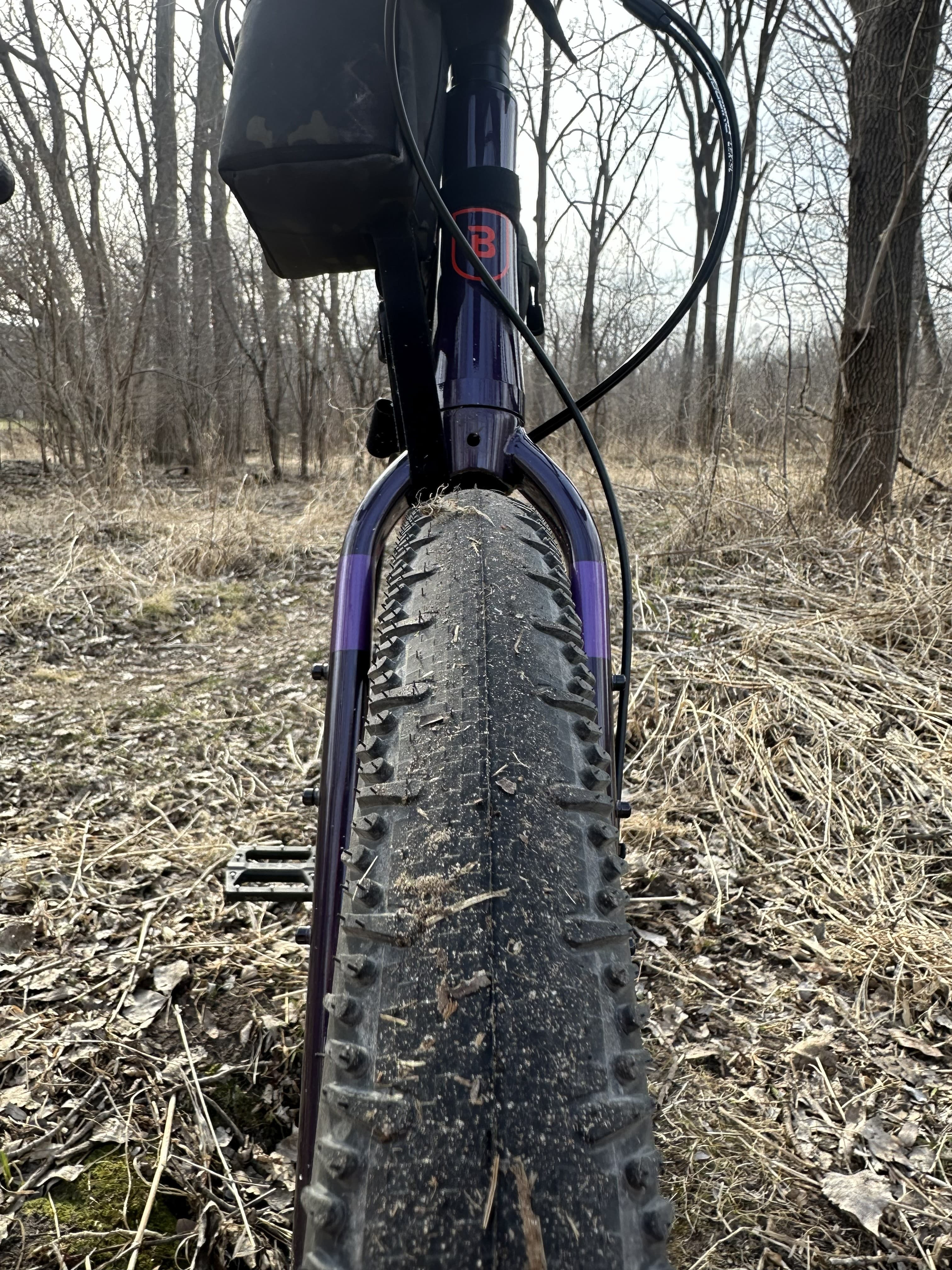 Rear tire mounted with directional arrow oriented for lower rolling resistance