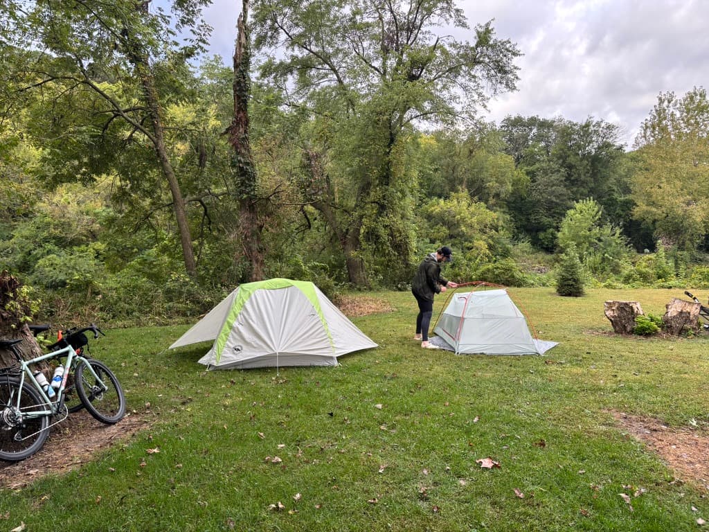 Setting up tent at campsite