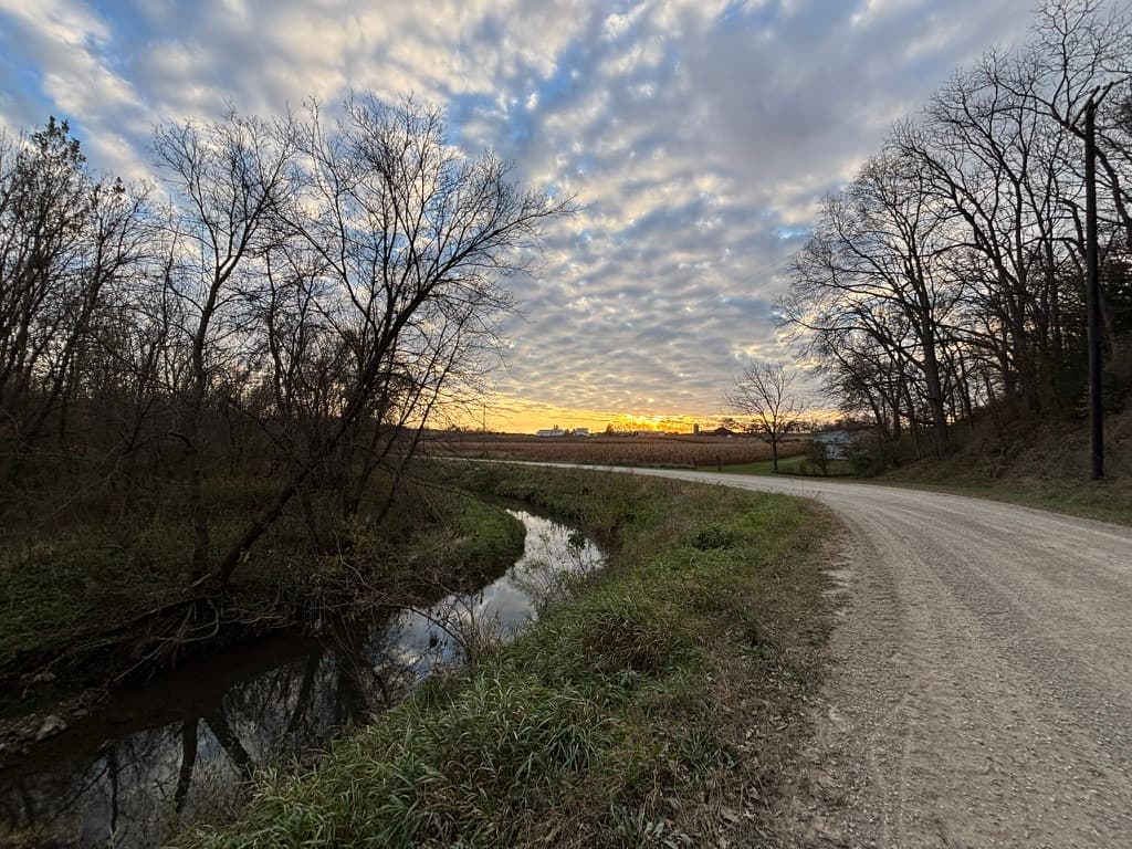 Wide creek road sunset landscape